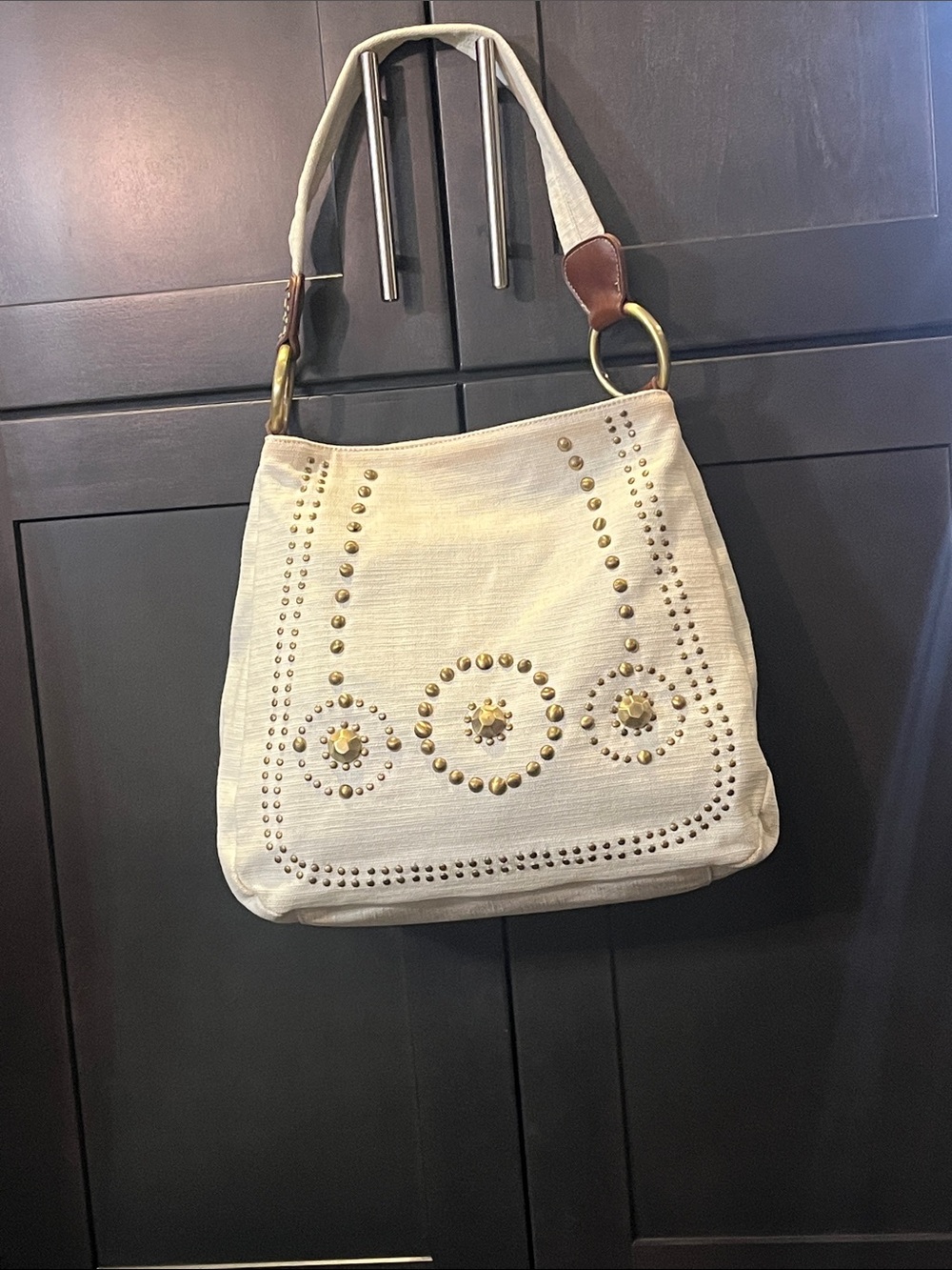 Franco Sarto Cream Tote with Teal and Gold Floral Lining. Stud Accents. Damaged